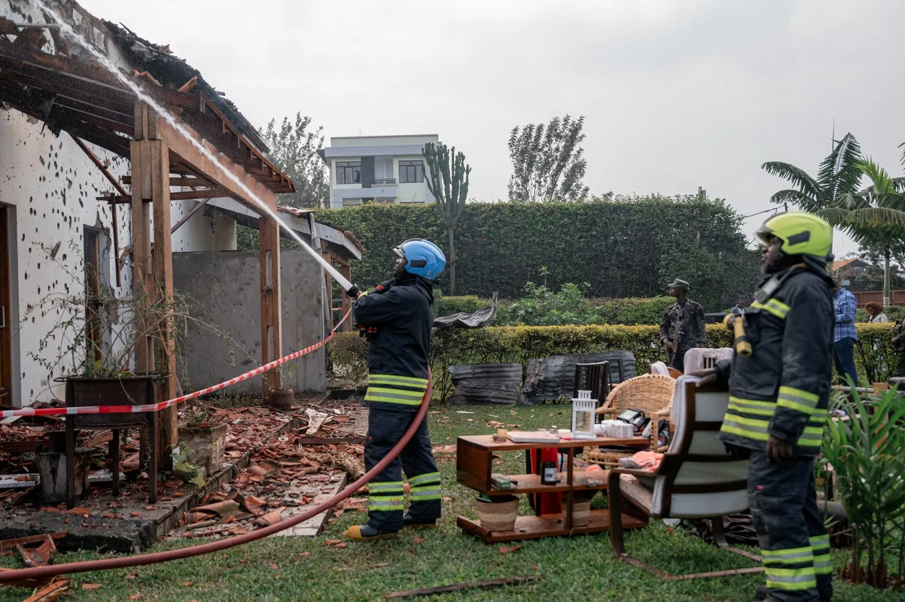 Firefighters extinguish a fire at a private residence damaged by a drone strike in Goma on March 11.