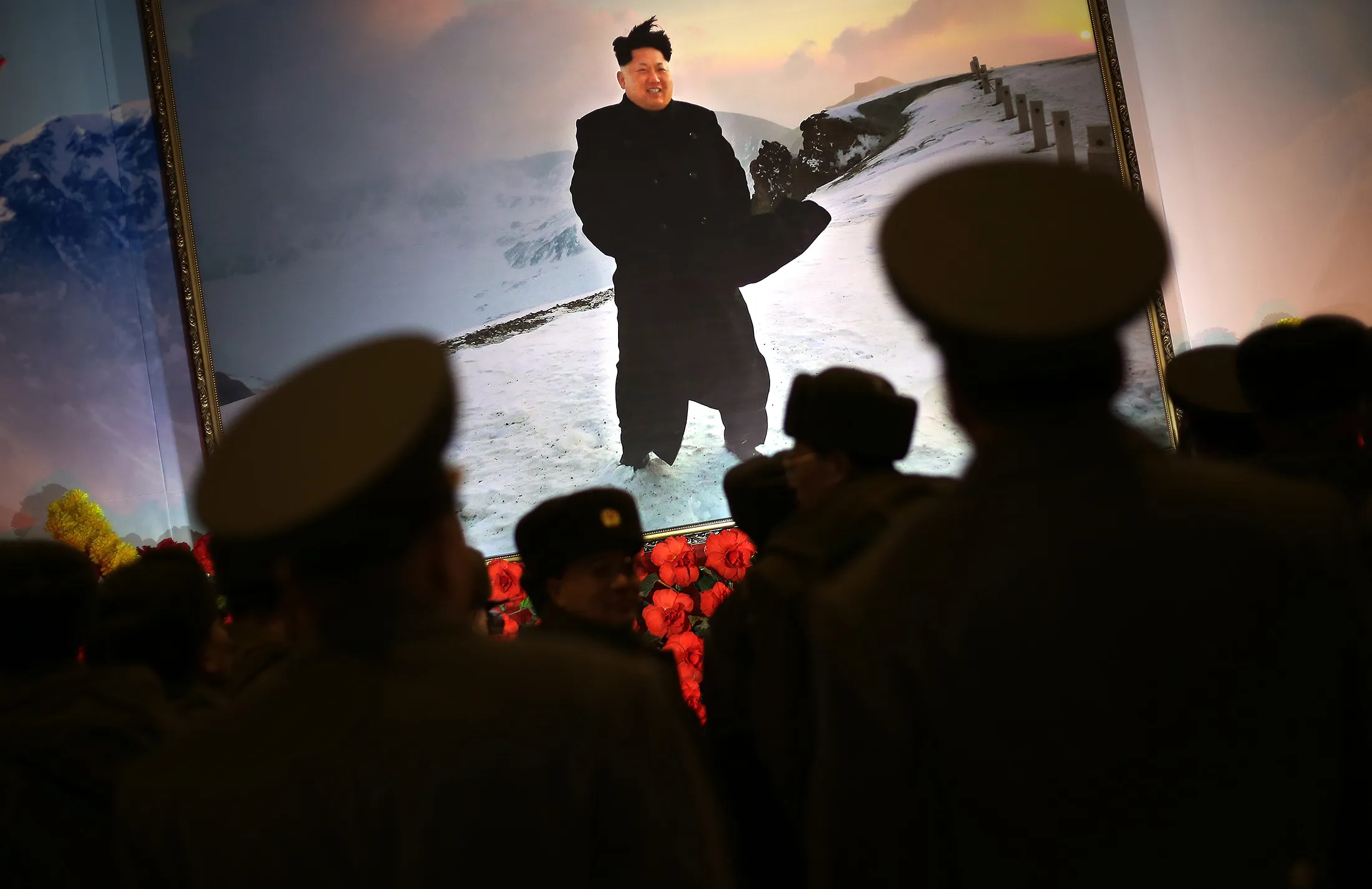 Soldiers stand in front of a portrait of North Korean leader Kim Jong Un in Pyongyang, on Feb. 15.

