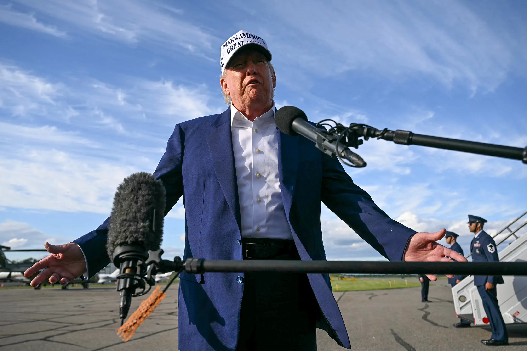 President Donald Trump speaks to members of the media before boarding Air Force One from Morristown Municipal Airport in Morristown, New Jersey, on May 25.