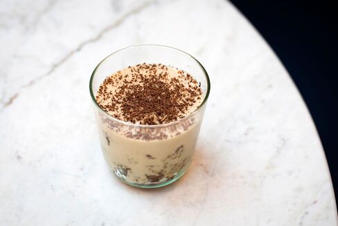 Tiramisu is served in a glass.