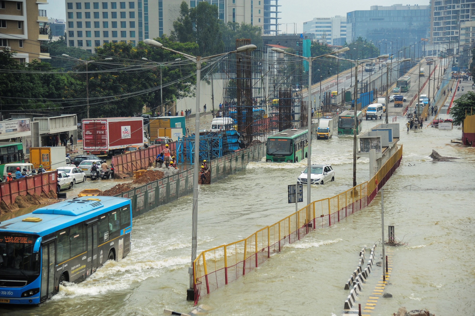 Vehicles make their way through a waterlogged road after heavy rains in a Bangalore on Sept. 6.