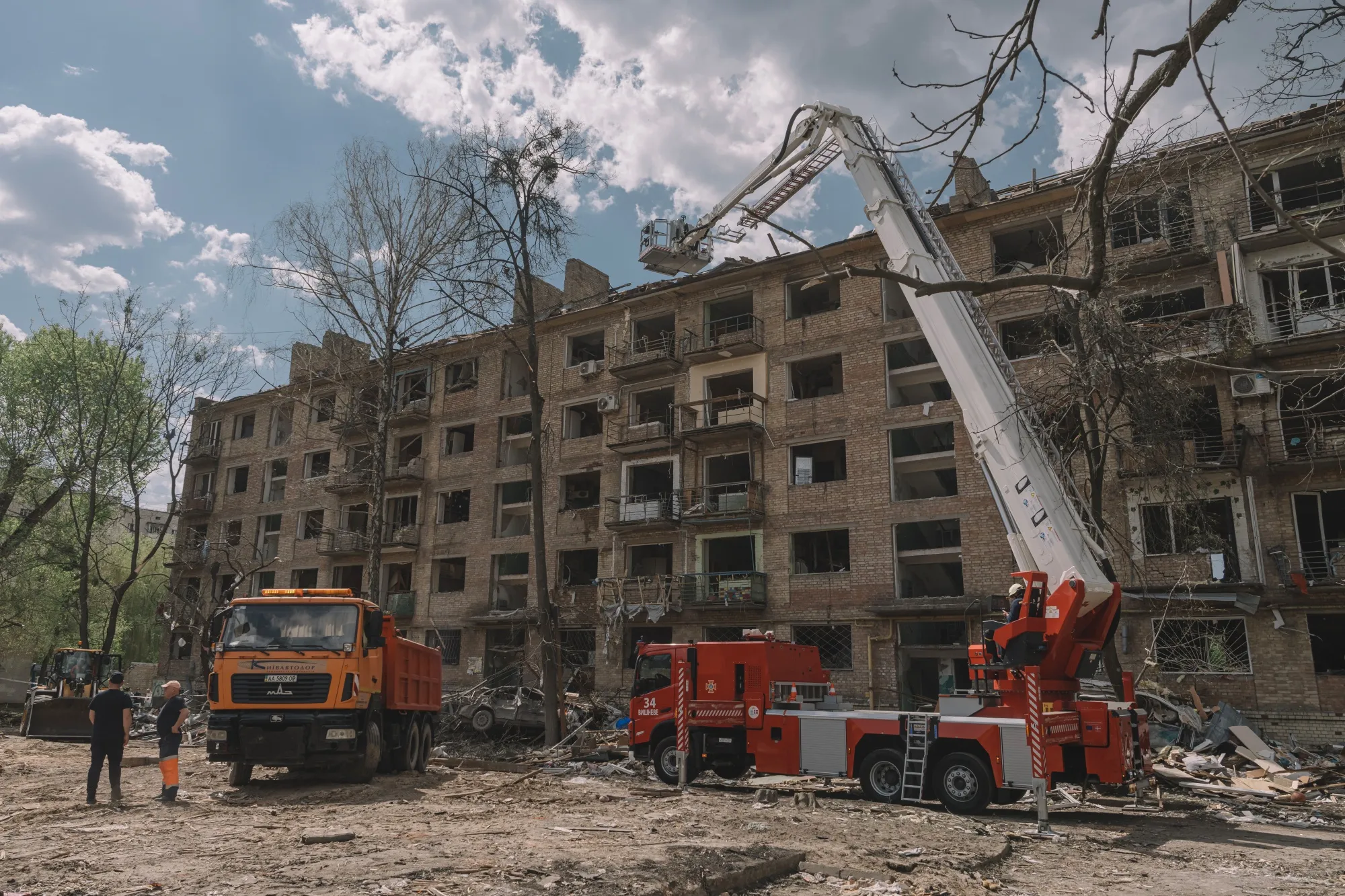 Rescue workers search an apartment building following a Russian missile strike in Kyiv, in April.