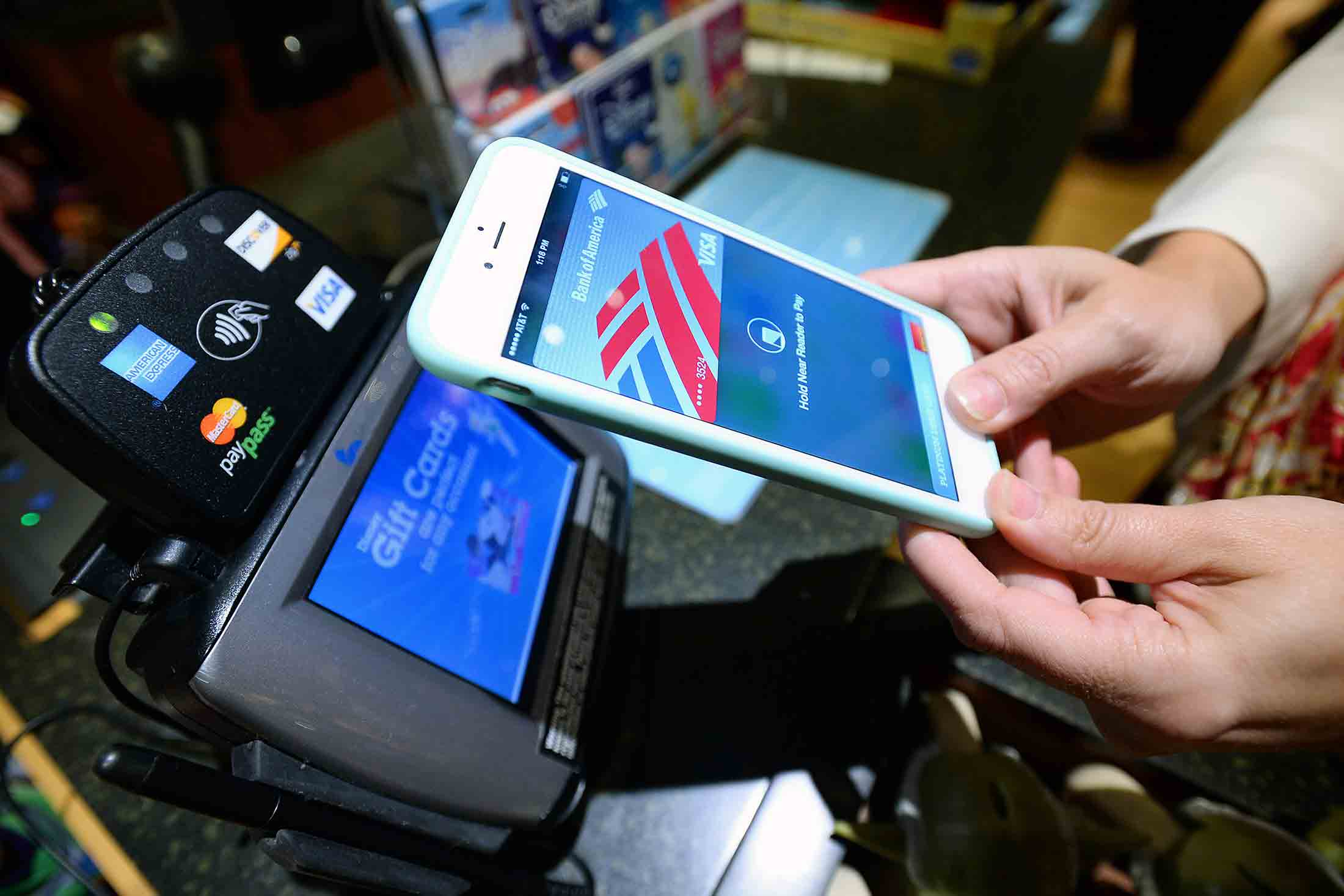A customer uses Apple Pay at a Disney store in Glendale, Calif.
