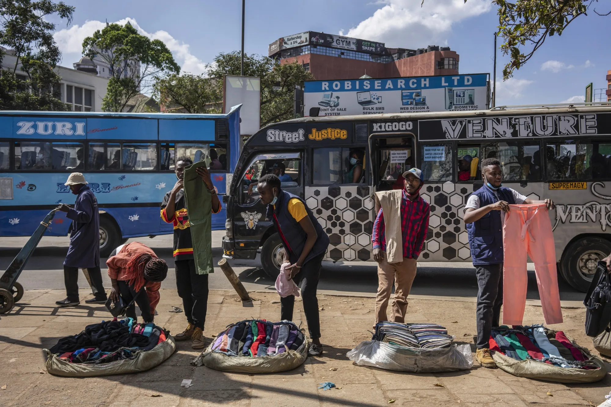 Street vendors sell second-hand clothing on a street in Nairobi in December.