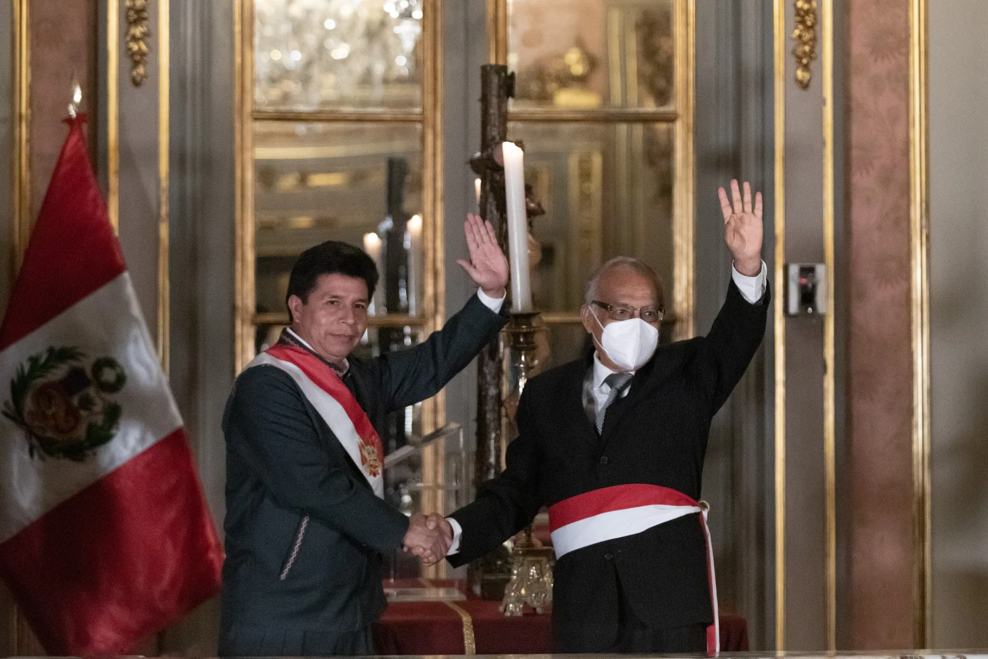 President Castillo shakes hands with Anibal Torres during a swearing-in ceremony at the Government Palace in Lima, Peru, on Feb. 8.