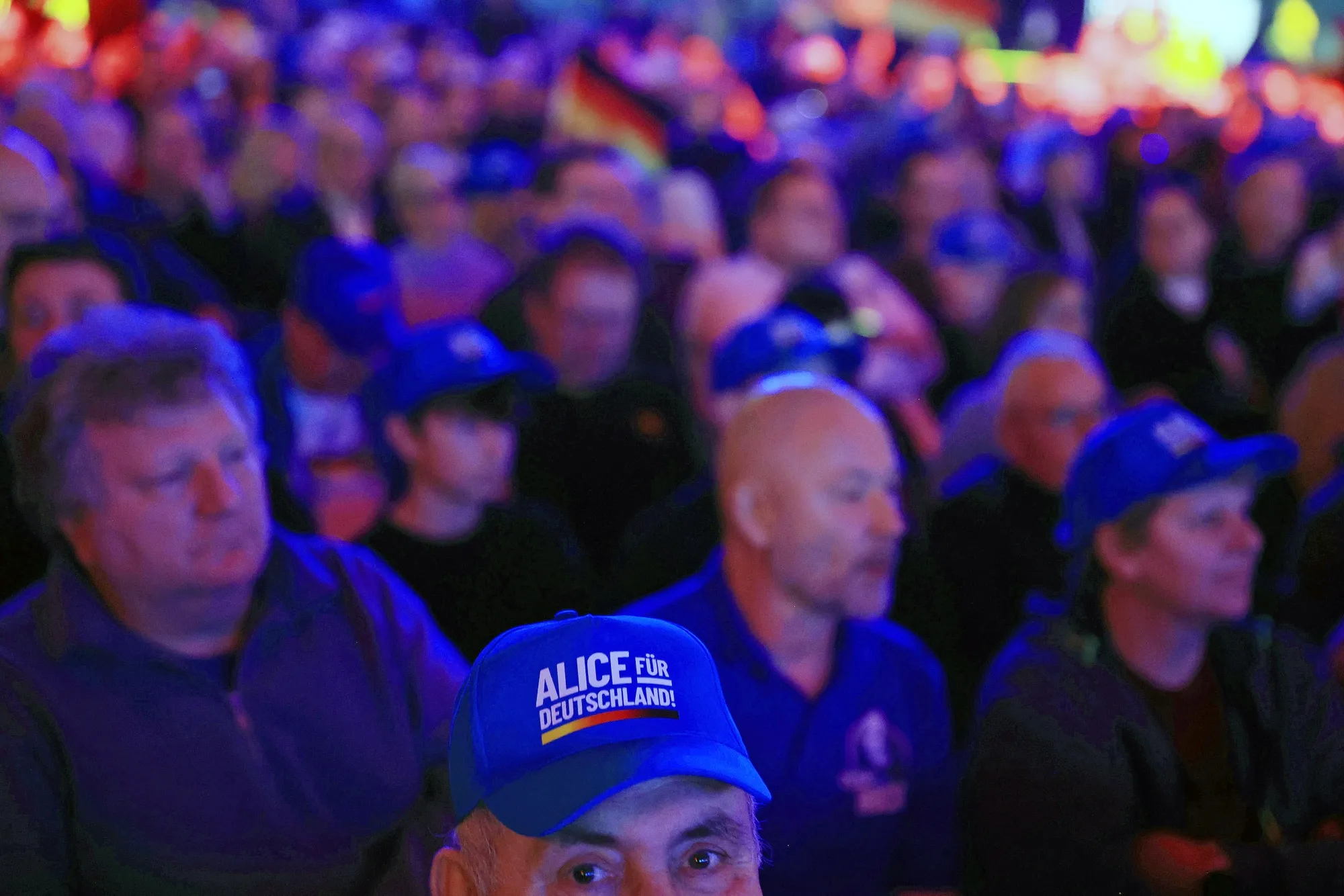 AfD supporters at a campaign campaign event. Ties to the MAGA movement&nbsp;continue to improve and are increasingly coordinated.