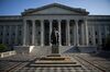 A statue of Albert Gallatin, a long-serving U.S. secretary of the Treasury, stands in front of the U.S. Treasury building in Washington, D.C., U.S., on Tuesday, Aug. 16, 2011.
