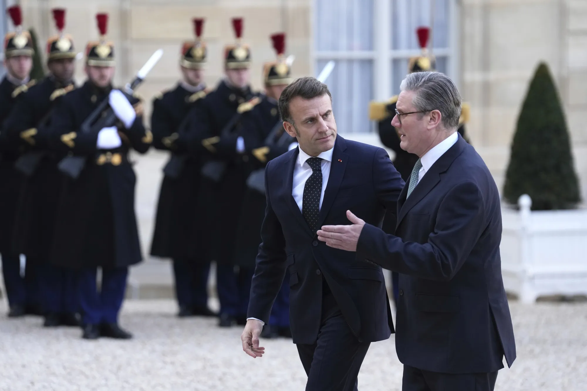 French President Emmanuel Macron greets UK Prime Minister Keir Starmer in Paris on Feb. 17.