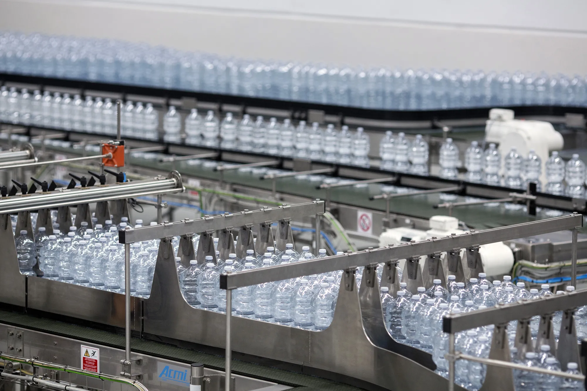 Bottles of Nestle Vera water move on the production line at a bottling plant in Castrocielo, Italy.
