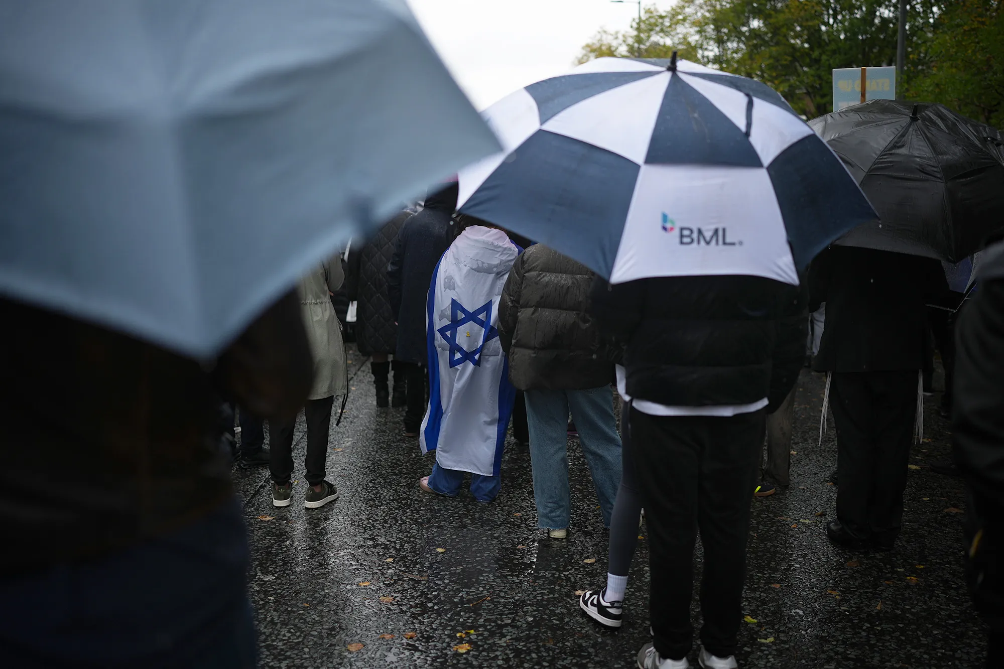 People attend a vigil to remember the victims of the Manchester Synagogue attack in Manchester, UK on Oct. 3.