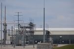 An electricity substation next to an Amazon Web Services data center in Johnstown, Ohio, US, on Saturday, March 23, 2024. Amazon.com Inc. plans to spend almost $150 billion in the coming 15 years on data centers, giving the cloud-computing giant the firepower to handle an expected explosion in demand for artificial intelligence applications and other digital services.