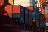 Containers sit stacked on a ship at a terminal in Yokohama, Japan, on Monday, Feb. 18, 2019. Japan is sticking to its view that the U.S. won’t apply higher tariffs on imports of Japanese cars and auto parts so long as negotiations toward a trade deal continue, according to Tokyo’s lead negotiator with Washington. Negotiations over a trade deal announced last September by Trump and Abe have yet to start, partly due to ongoing talks between Washington and Beijing.