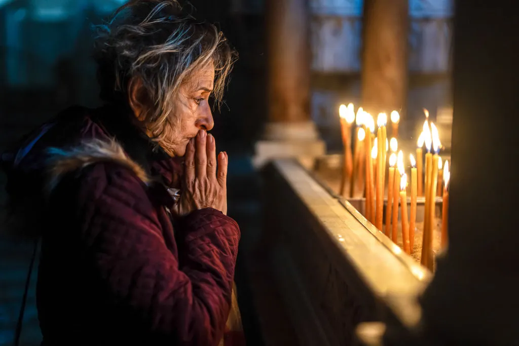 A woman prays at the Church of the Holy Sepulchre&nbsp;in Jerusalem, Israel.