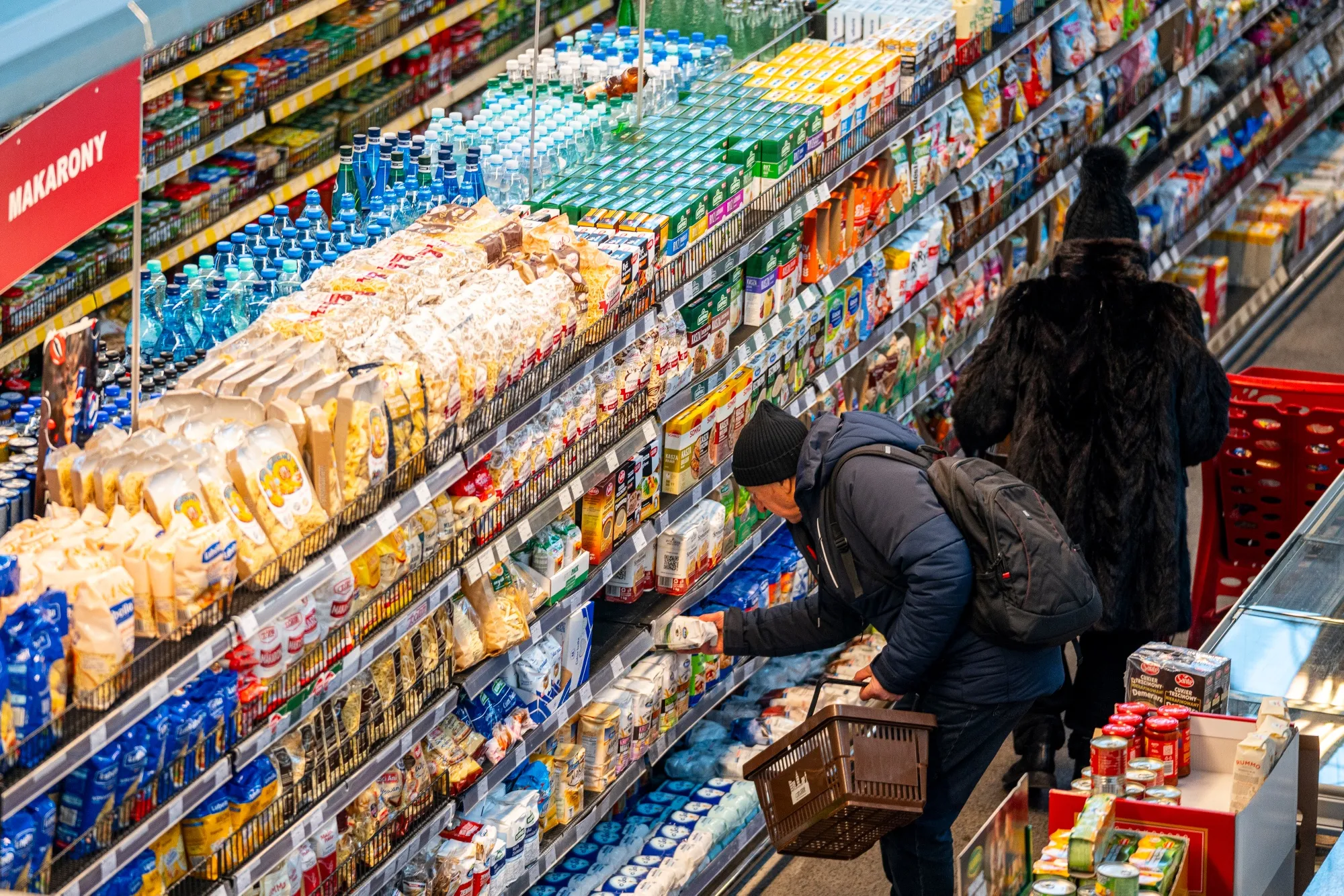 Customers shop&nbsp;inside a market hall in Warsaw.