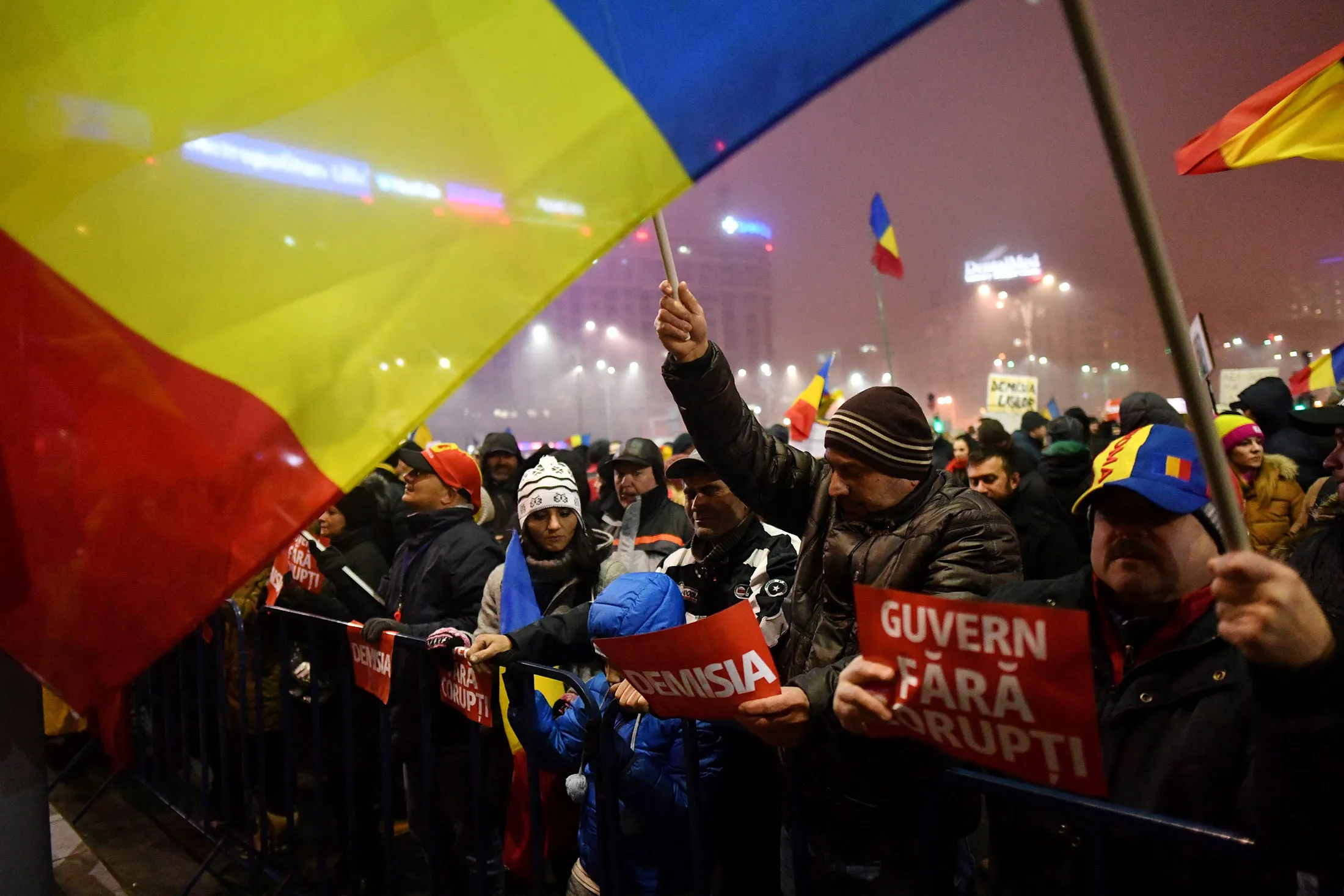 People with Romanian flags protest against the government in Bucharest on Feb. 6.
