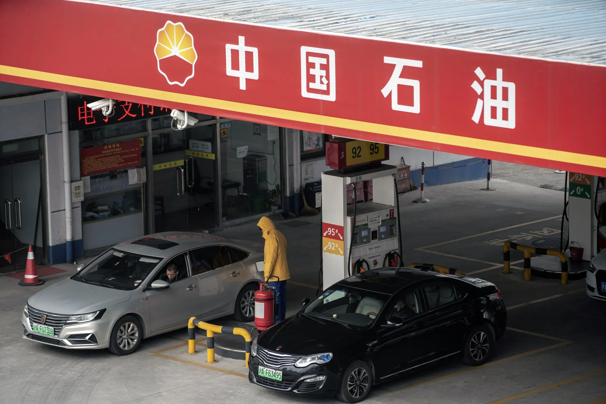 Vehicles refuel at a PetroChina Co. gas station in Shanghai, China.