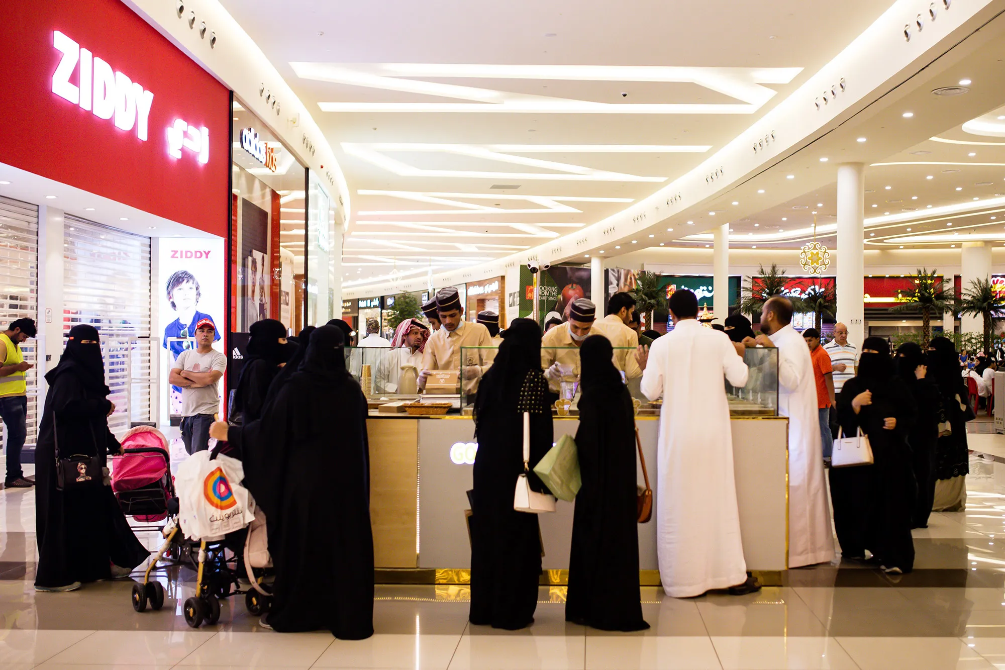 Men and women shop at a mall in Jeddah, Saudi Arabia.