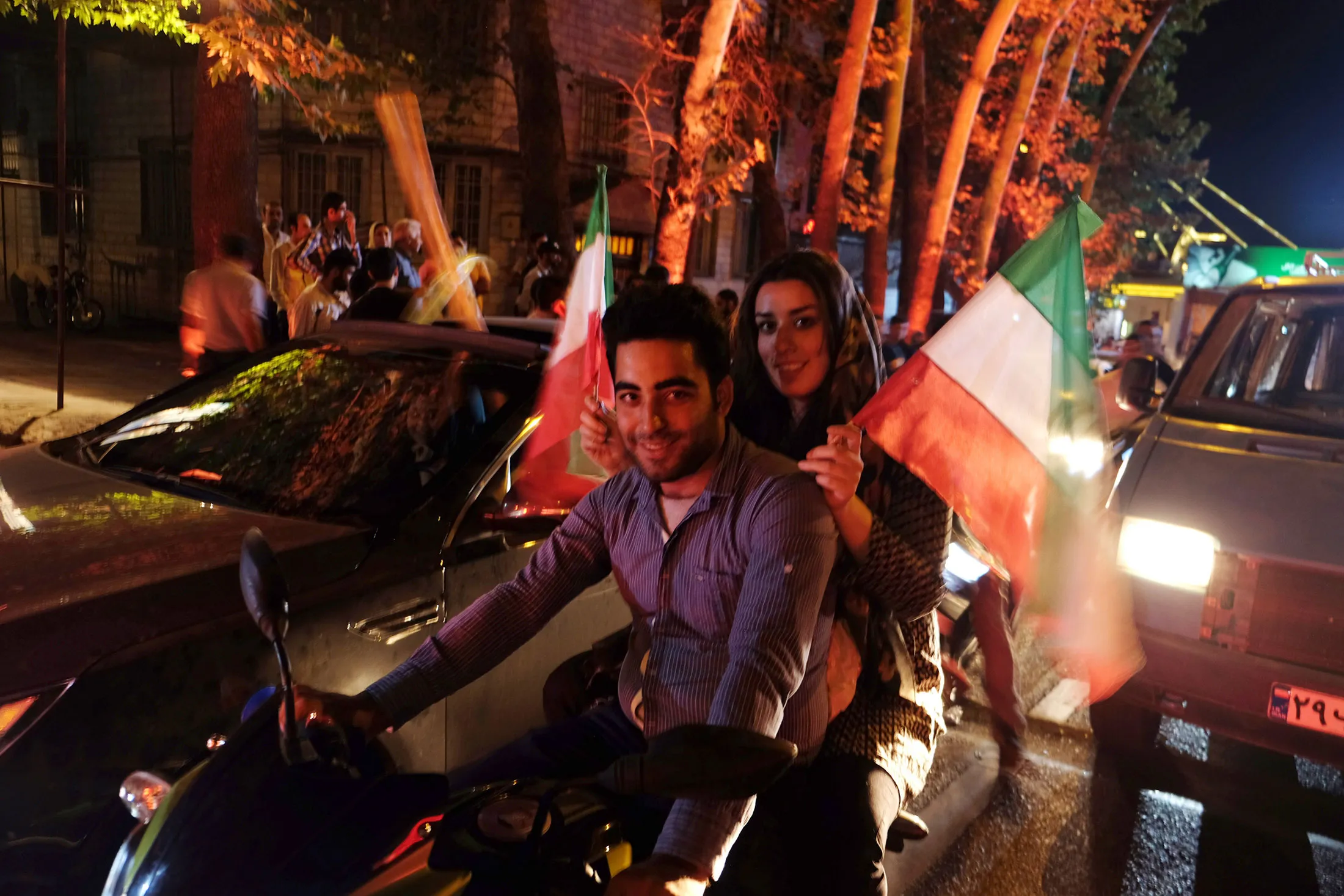 People celebrate after the 5+1 nuclear agreement was announced on Vali Asr Avenue in Tehran, Iran, on July 14, 2015.
