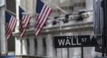 A Wall Street sign hangs in front of the New York Stock Exchange (NYSE) in New York.
