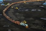 Front-loaders arrange stacks of coal as a freight train sits on rail tracks at Krishnapatnam Port in Krishnapatnam, Andhra Pradesh, India.