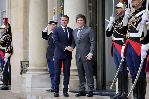 Emmanuel Macron greets Javier Milei at the Elysee palace in Paris on July 26.