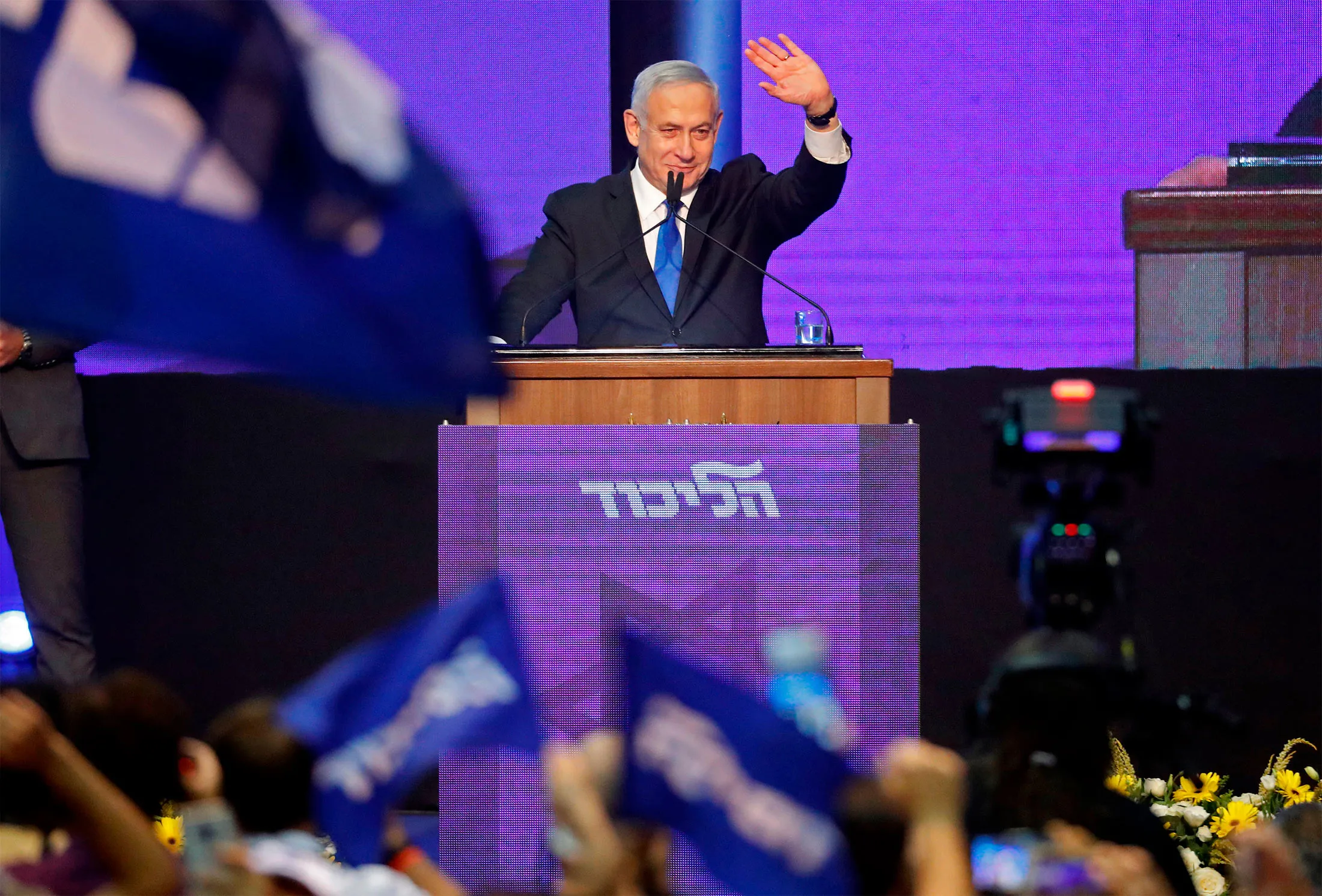 Benjamin Netanyahu addresses supporters at his Likud party's electoral campaign headquarters early on Sept. 18.