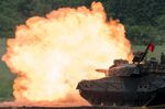 A Japan Ground Self-Defense Force&nbsp;battle tank fires ammunition during a live fire exercise on May 28.