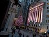 The New York Stock Exchange stands illuminated at night in New York.