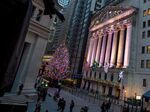 The New York Stock Exchange stands illuminated at night in New York.