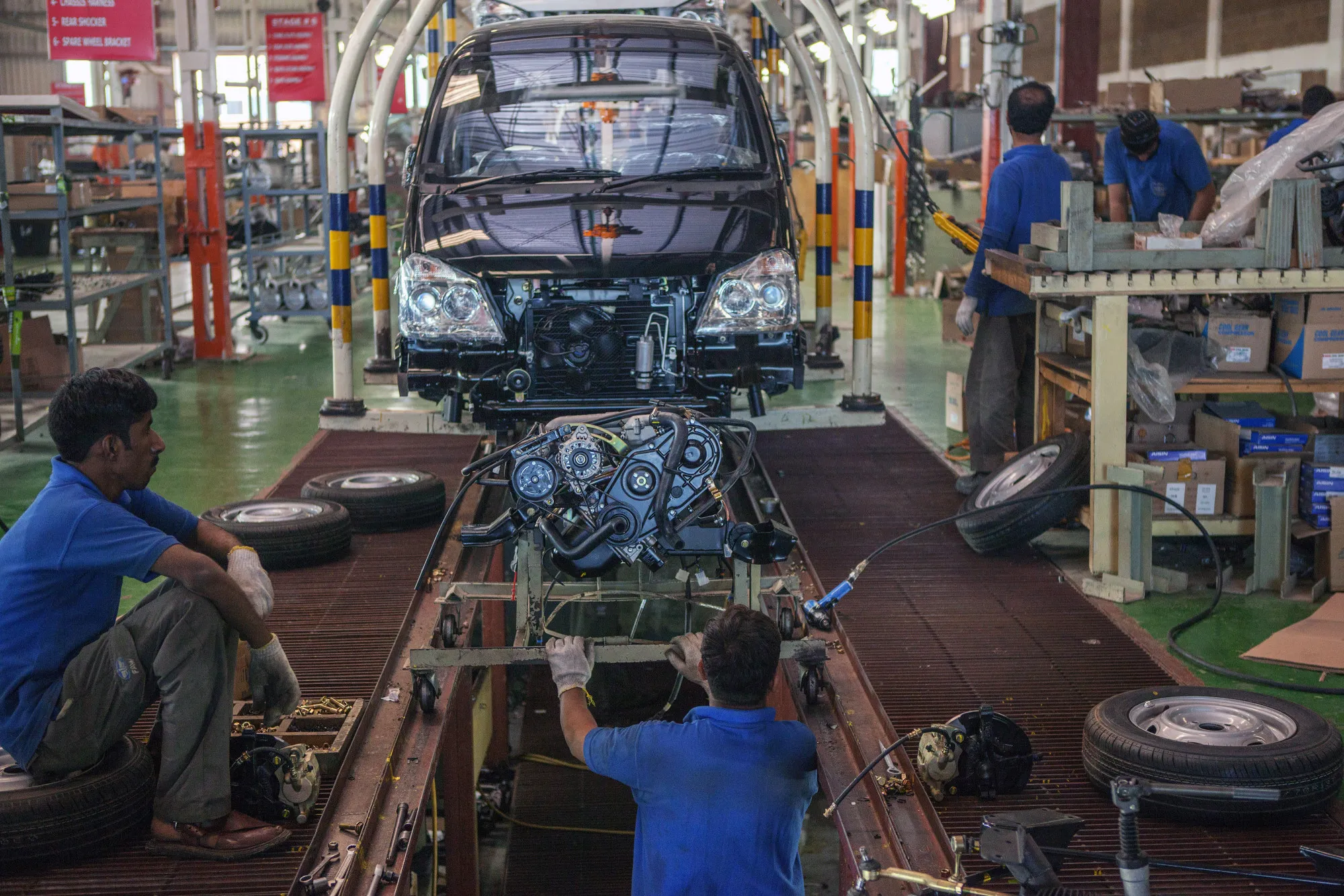 Employees work&nbsp;at an assembly plant&nbsp;in Karachi, Pakistan.