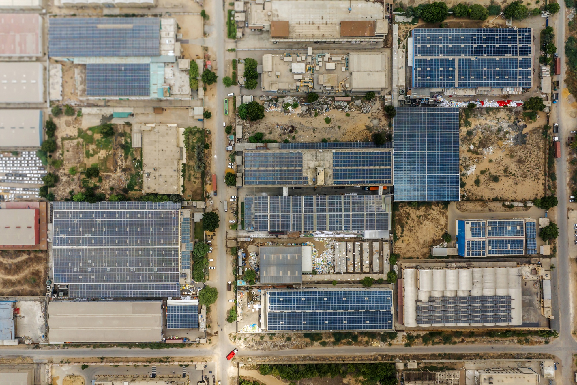 Solar panels are widely installed on the roofs of factories across the Bin Qasim Industrial Zone. Photographer: Asim Hafeez/Bloomberg