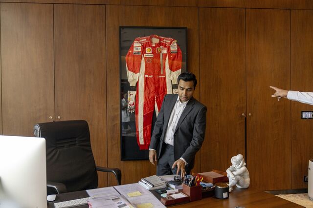Karan's office in Ahmedabad. On the wall, a framed F1 racing suit that was worn by Michael Schumacher.