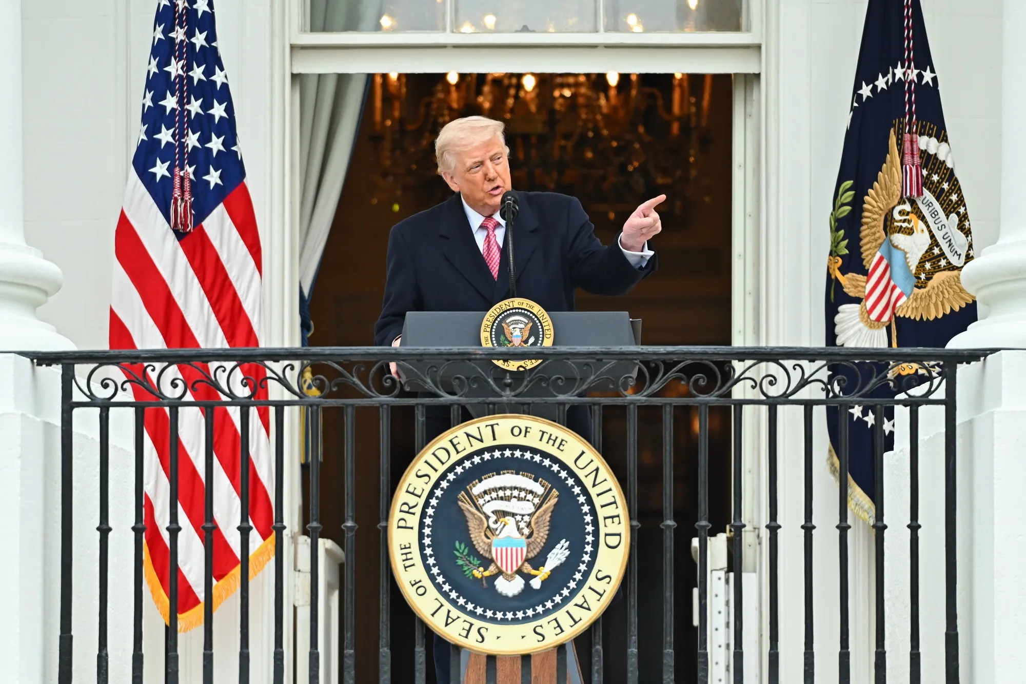 President Donald Trump speaks on the Truman balcony during an event on the South Lawn of the White House in Washington on March 27.