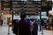 Train commuters look at the departure board at Marylebone Station in London, U.K., on Saturday, Jan. 1, 2000. Photographer: Simon Dawson/Bloomberg