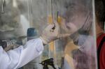 A member of the public gets his nose swabbed for a Covid-19 antigen test in Quezon City, the Philippines, earlier in January.