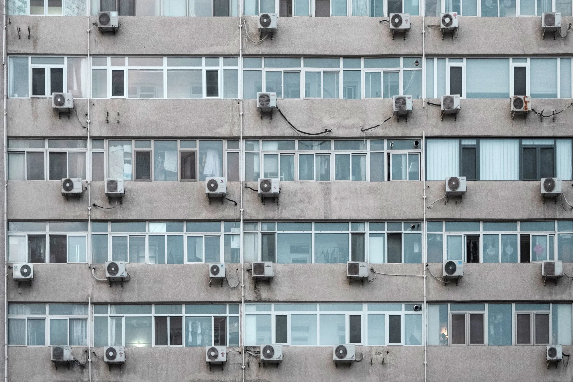 Air conditioning units hanging from a building in Beijing, China.
