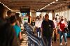 Commuters walk along a concourse at Clapham Junction railway station in London.