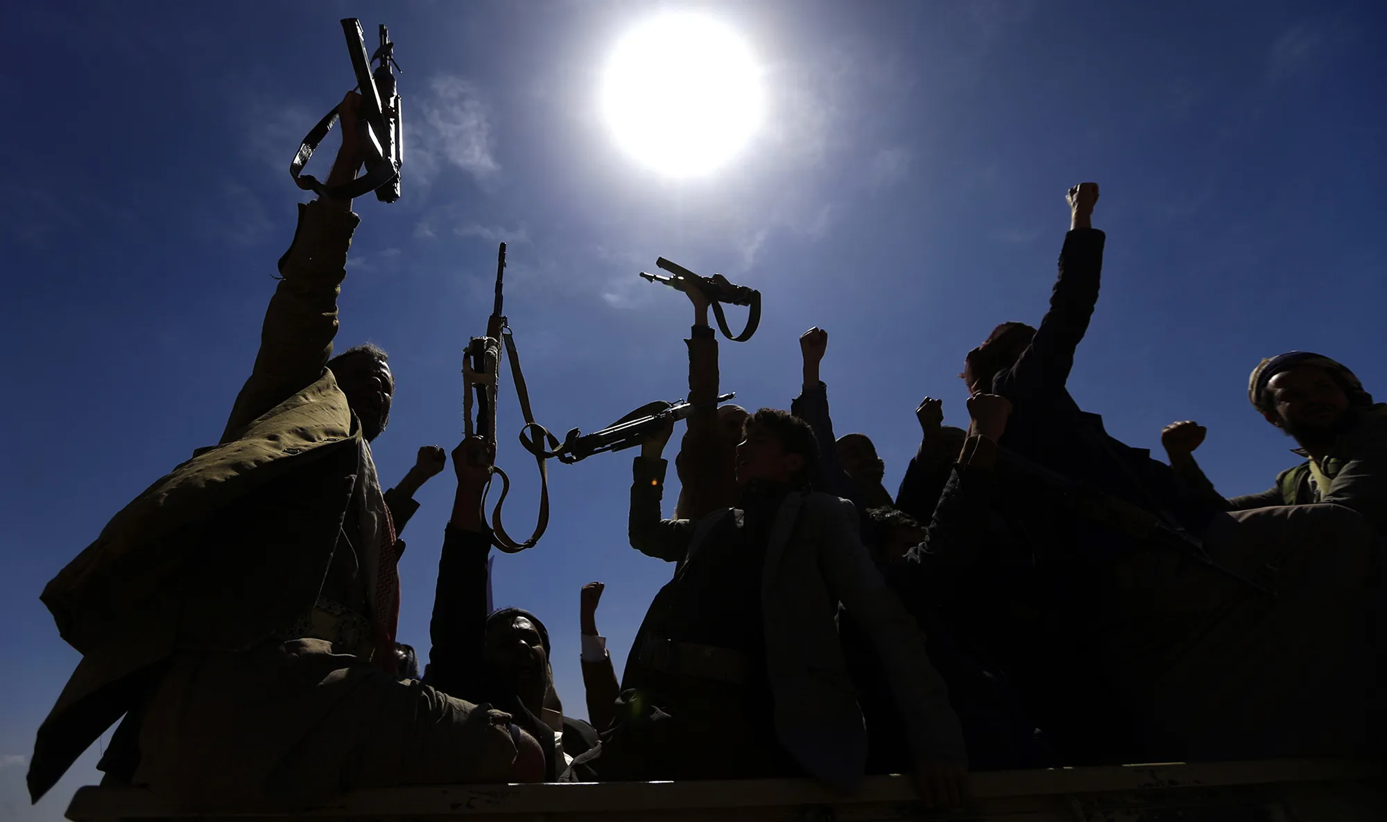 Armed Yemeni men raise their weapons as they gather near the capital Sanaa to show their support to the Shiite Huthi movement against the Saudi-led intervention on Feb.&nbsp;21, 2019.&nbsp;