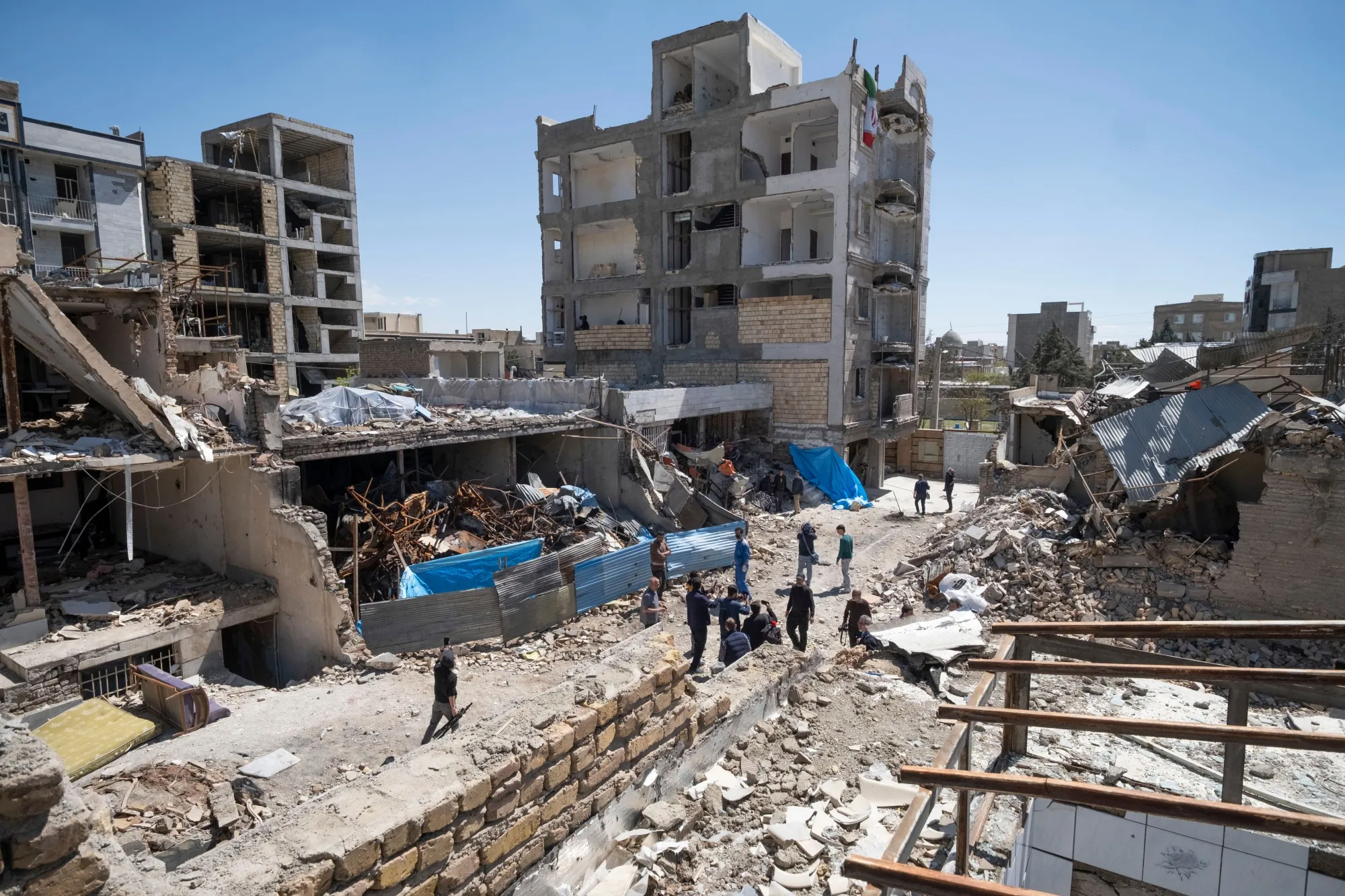 Damaged buildings in a residential area in Karan.