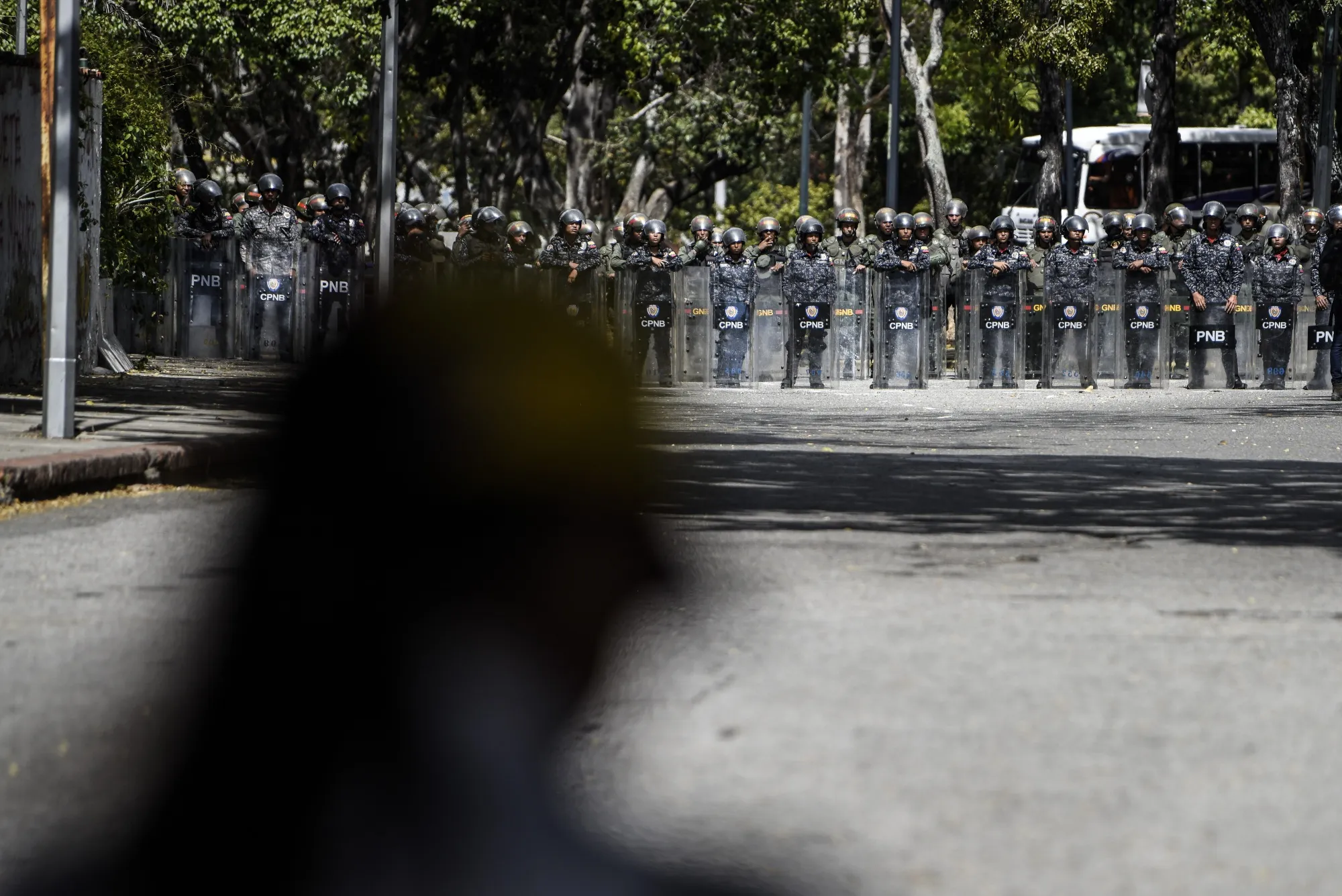 Bolivarian National Police stand guard during a protest against President Nicolas Maduro in the Los Ruices neighborhood of Caracas on Jan. 30, 2019.