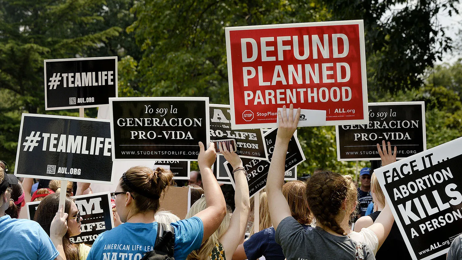 WASHINGTON, DC - JULY 28: Anti-abortion activists hold a rally opposing federal funding for Planned Parenthood in front of the U.S. Capitol on July 28, 2015 in Washington, DC. Sen. Rand Paul (R-KY) announced a Senate deal to vote on legislation to defund Planned Parenthood before the Senate goes into recess in August.
