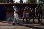 A worker disinfects a public bus terminal in Tehran.