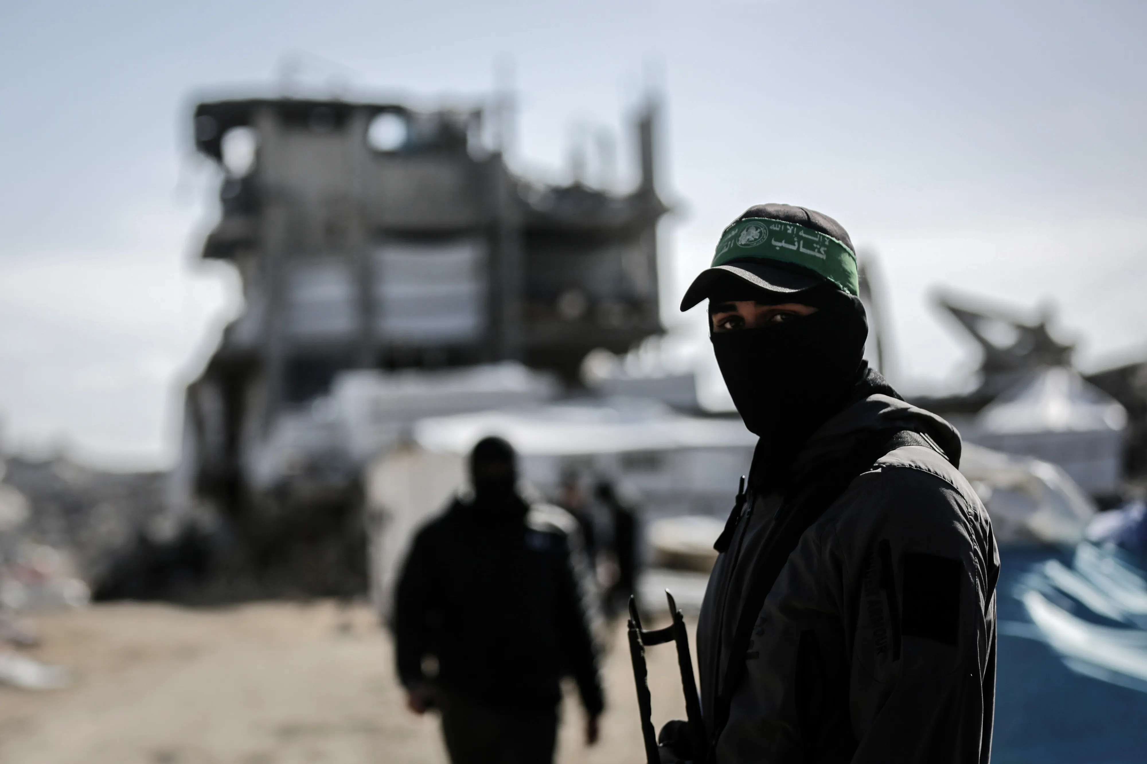 Armed members of Hamas’s al-Qassam Brigades during a search for the bodies of Israeli hostages at the Jabalia refugee camp in northern Gaza.