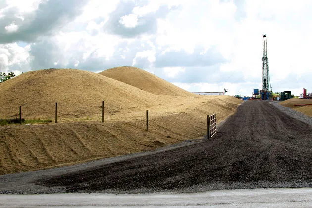 A crew works on a drilling rig at a well site for shale-based natural gas in Zelienople, Pa.