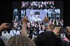 A fan holds up a photo of a Korean boyband star during 2018 KCon in New Jersey..