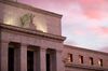 The Marriner S. Eccles Federal Reserve building stands at sunrise in Washington, D.C., U.S., on Tuesday, Oct. 28, 2014. The Federal Open Market Committee meets today and tomorrow after six weeks of volatility in global financial markets. Since the FOMC met in mid-September, oil prices have tumbled 14 percent, and the Standard & Poor's 500 Index of stocks dropped as much as 7.4 percent from a record close.