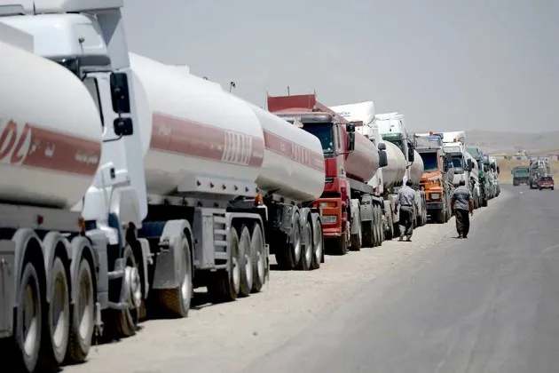Trucks lining up at a busy oil refinery near Erbil, in Kurdish-controlled Iraq