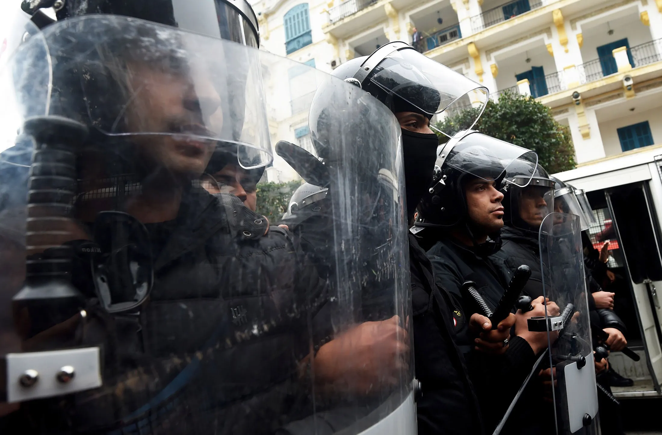 Tunisian police stand guard as citizens demonstrate in Tunis&nbsp;on Jan. 9, 2018.&nbsp;