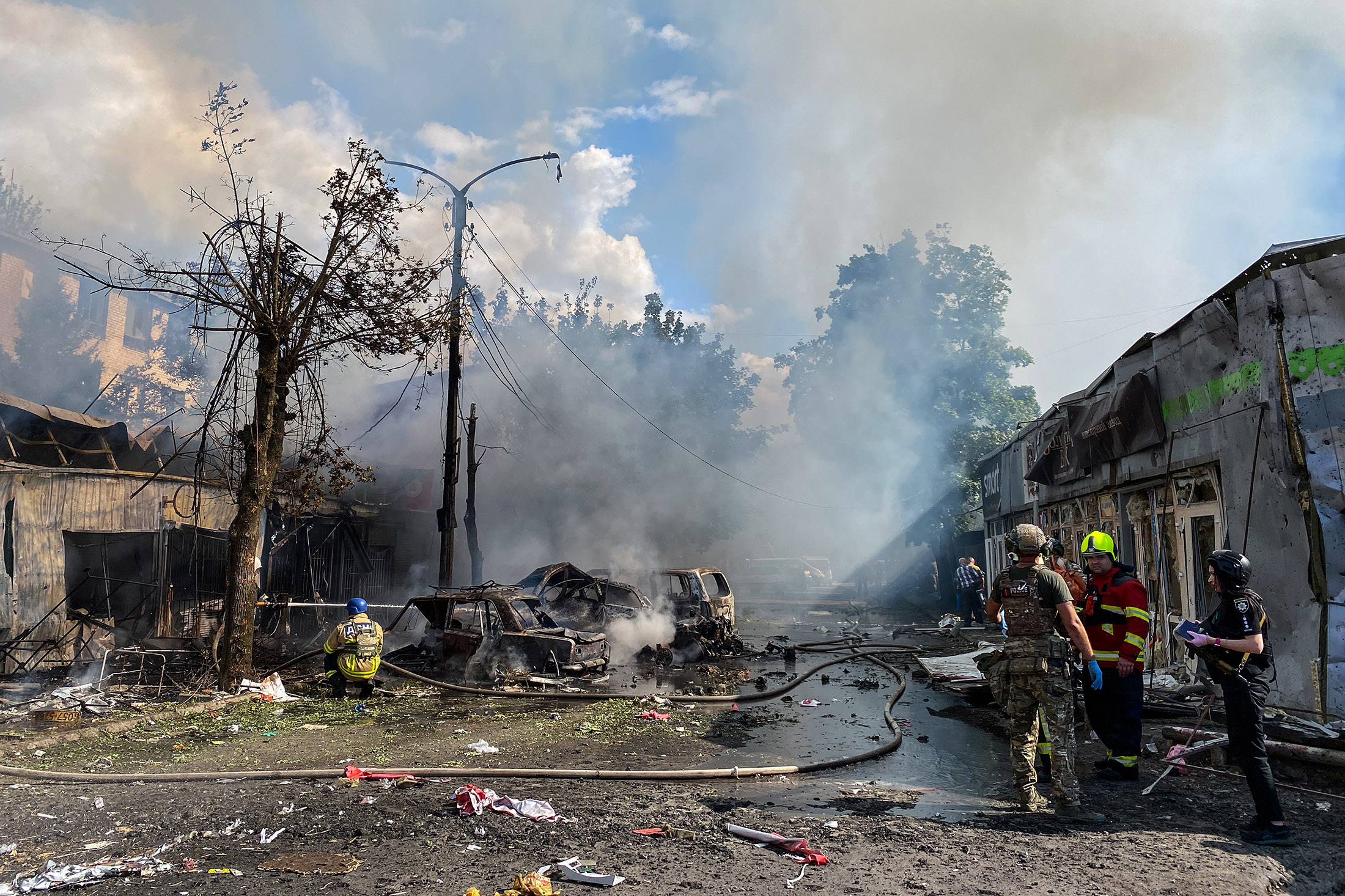 Firefighters extinguish a fire in a market following rocket strikes in Kostiantynivka, Ukraine, on Sept. 6.