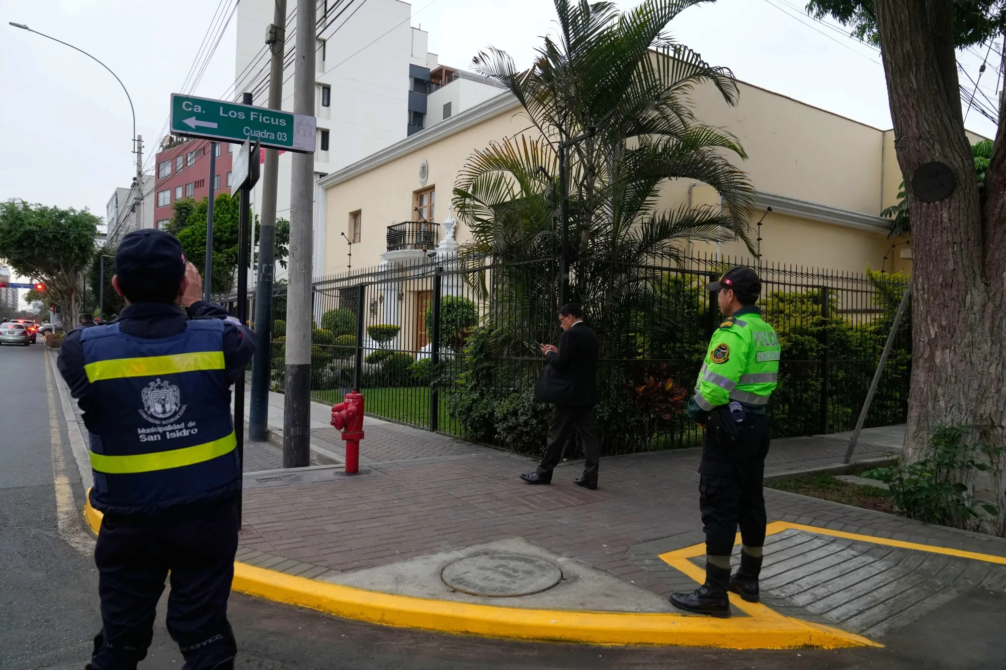 Police officers stand guard in front of Mexico's embassy in Lima after former Prime Minister Betssy Chávez entered to seek asylum on Nov. 3.